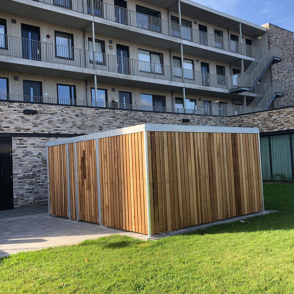 Fietsoverkapping en berging voor containers in 1 voor apotheek